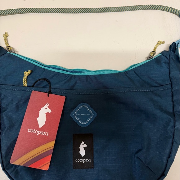 Cotopaxi Navy Crossbody Bag with Teal Accents - Picture 3 of 5